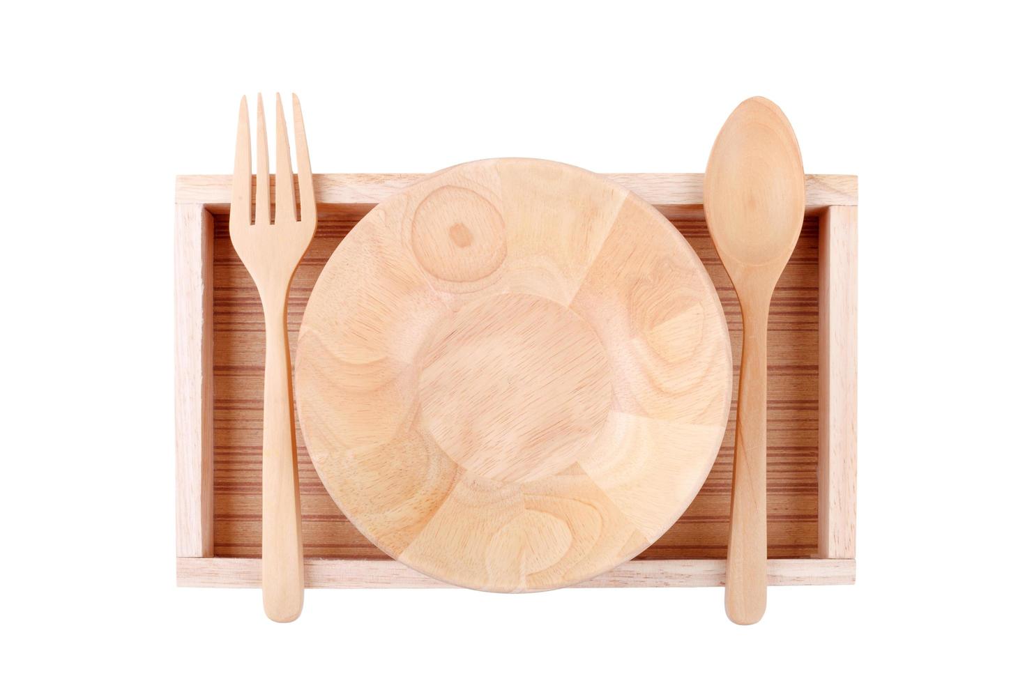 cucchiaio di ciotola di legno e forchetta isolati su sfondo bianco foto