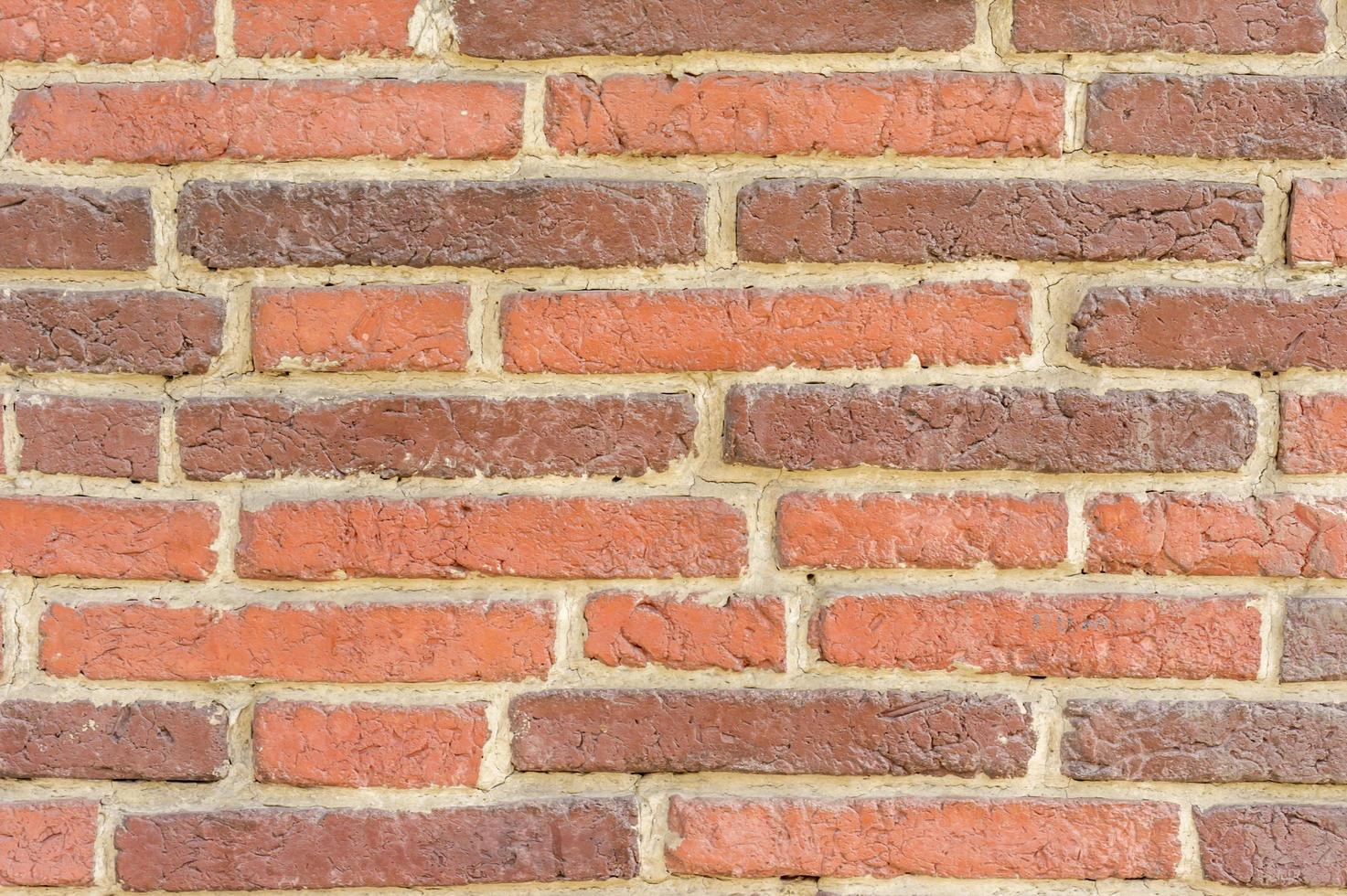 vecchio fondo di struttura del muro di mattoni marrone foto