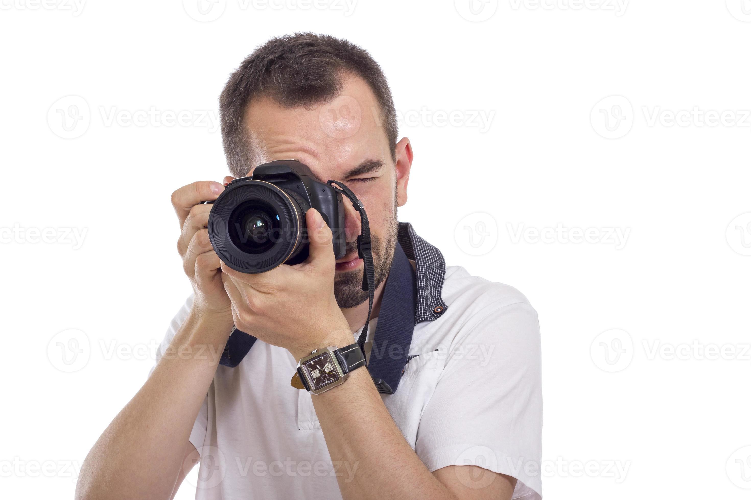 giovane fotografo isolato su bianco foto