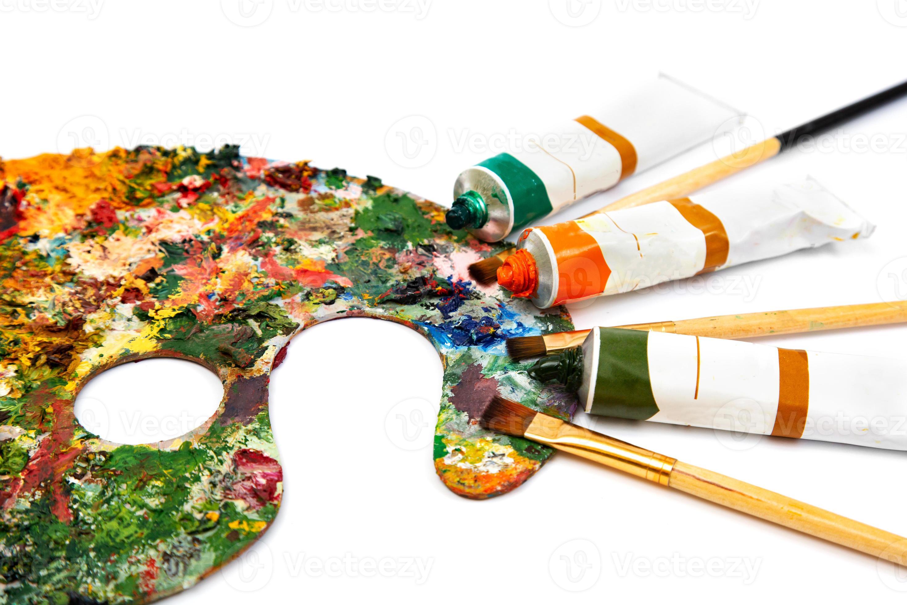 tubi di pittura a olio multicolore e pennelli per artisti su tela primo  piano. tavolozza con colori colorati 5499906 Stock Photo su Vecteezy