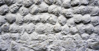 grigio pietra grano modello bolla parete spray verniciato strutturato e graffiato cemento sfondo in stile retrò con copia spazio foto