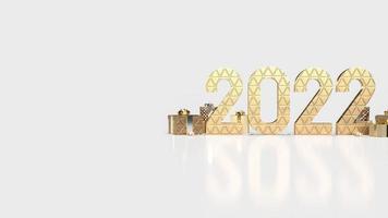 il numero d'oro 2022 e la confezione regalo su sfondo bianco per il rendering 3d del concetto di business o di Capodanno foto