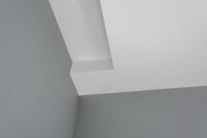 dettaglio del soffitto ad angolo con intricate modanature a corona. foto