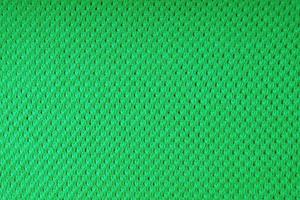 luminosa verde maglieria lana tessuto struttura sfondo. astratto tessile fondale foto