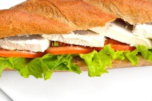 Sandwich su un' bianca superficie foto