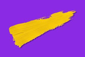 giallo spazzola e ombra isolato su un' viola sfondo foto
