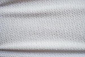 sfondo di struttura del tessuto in jersey sportivo bianco foto