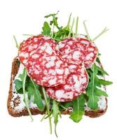 Sandwich a partire dal salame, grano pane e rucola foto