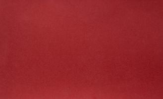 un' Vintage ▾ rosso sfondo con un' incrociato maglia modello e grunge macchie foto