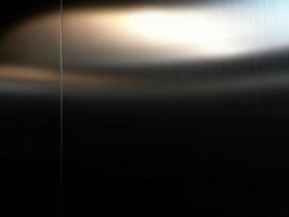 lamiera di acciaio inossidabile di grandi dimensioni con luce che colpisce la superficie per lo sfondo, all'interno dell'ascensore passeggeri, riflesso della luce su una struttura metallica lucida, sfondo in acciaio inossidabile. foto