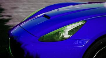 faro di un' lusso blu auto sportiva foto