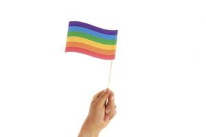 mano con bandiera gay lgbt colori foto
