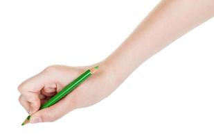 mano disegna di verde matita isolato su bianca foto