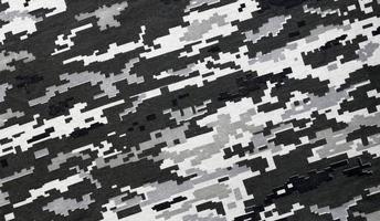 tessuto con struttura di ucraino militare pixeled camuffare. stoffa con Camo modello nel grigio, Marrone e verde pixel forme. ufficiale uniforme di ucraino soldati foto