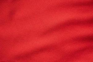 rosso gli sport capi di abbigliamento tessuto calcio maglia struttura vicino su foto