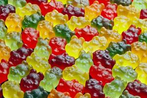 fotogramma intero sfondo di colorato gelatina orsi di cui strettamente su piatto superficie foto