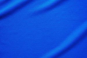 blu calcio maglia capi di abbigliamento tessuto struttura gli sport indossare sfondo, vicino su superiore Visualizza foto