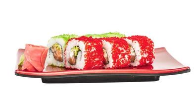 tobiko speziato maki Sushi - caldo rotolo con vario genere di volante pesce capriolo fuori. salmone, avocado e verde lattuga dentro foto