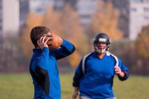 americano calcio squadra con allenatore nel azione foto