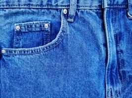 blu denim jeans tasca con revisioni struttura sfondo foto