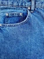 blu denim jeans tasca con revisioni struttura sfondo foto