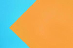 blu e arancia pastello colore carta struttura superiore Visualizza minimo piatto posare sfondo foto
