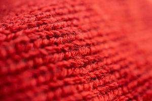 avvicinamento rosso a maglia di lana tessuto struttura sfondo foto