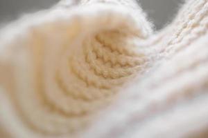 avvicinamento beige a maglia di lana tessuto struttura sfondo foto
