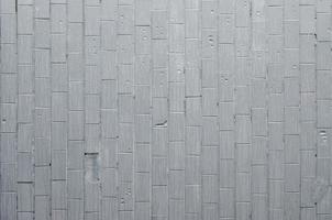 il struttura di il parete a partire dal il vecchio piastrella, dipinto grigio sotto il influenza di condensazione. un' lotto di piccolo gocce e acqua macchie su il parete foto