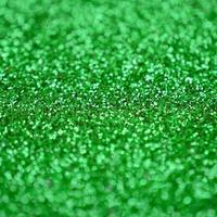 un' enorme quantità di verde decorativo paillettes. sfondo Immagine con brillante bokeh luci a partire dal piccolo elementi foto