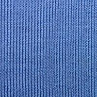 il struttura di il tessuto nel blu colore. Materiale per fabbricazione camicie e camicette foto