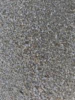 Questo è un' immagine di un' sfondo di sabbia su il spiaggia quello ha appena stato lavato lontano di il onde foto