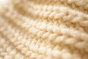 avvicinamento beige a maglia di lana tessuto struttura sfondo foto