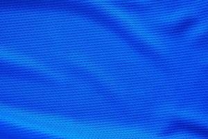 blu calcio maglia capi di abbigliamento tessuto struttura gli sport indossare sfondo, vicino su superiore Visualizza foto