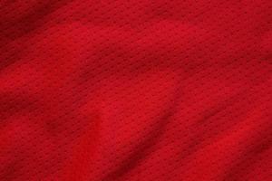 rosso gli sport capi di abbigliamento tessuto calcio camicia maglia struttura vicino su foto