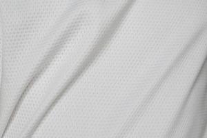 bianca gli sport capi di abbigliamento tessuto calcio camicia maglia struttura sfondo foto