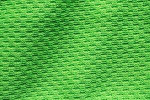 verde gli sport capi di abbigliamento tessuto calcio camicia maglia struttura vicino su foto