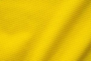 giallo gli sport capi di abbigliamento tessuto calcio camicia maglia struttura vicino su foto