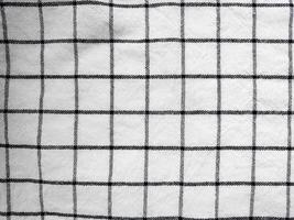 scacchi tovaglia tessuto o asciugamano. nero con bianca piazza modello foto