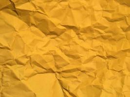 astratto struttura di giallo rugosa carta sfondo per design. copia spazio per testo o opera foto