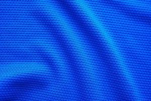 blu calcio maglia capi di abbigliamento tessuto struttura gli sport indossare sfondo, vicino su superiore Visualizza foto