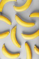 geometrico modello di giallo banane su un' grigio sfondo nel il alla moda colori di 2021. foto