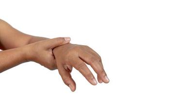 il mano di un' persona con polso dolore su un' bianca sfondo , il concetto di malattia a partire dal Lavorando difficile. foto