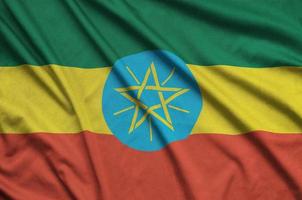 Etiopia bandiera è raffigurato su un' gli sport stoffa tessuto con molti pieghe. sport squadra bandiera foto