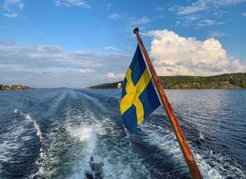 svedese bandiera su un' andare in barca barca 6 foto