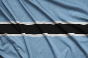 Botswana bandiera è raffigurato su un' gli sport stoffa tessuto con molti pieghe. sport squadra bandiera foto