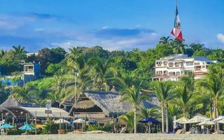 puerto escondido oaxaca Messico 2022 palme ombrelloni sole lettini spiaggia ricorrere zicatela puerto escondido Messico. foto