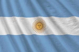 argentina bandiera con grande pieghe agitando vicino su sotto il studio leggero al chiuso. il ufficiale simboli e colori nel bandiera foto