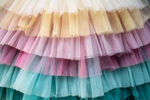 tessuto multicolore strutturato sfondo. dettagli di un' bellissimo luminosa vestire. flatley. copia spazio. foto