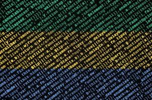 Gabon bandiera è raffigurato su il schermo con il programma codice. il concetto di moderno tecnologia e luogo sviluppo foto